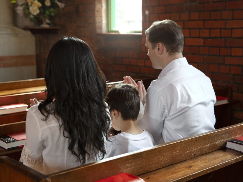 Faith christian family praying church medium shot